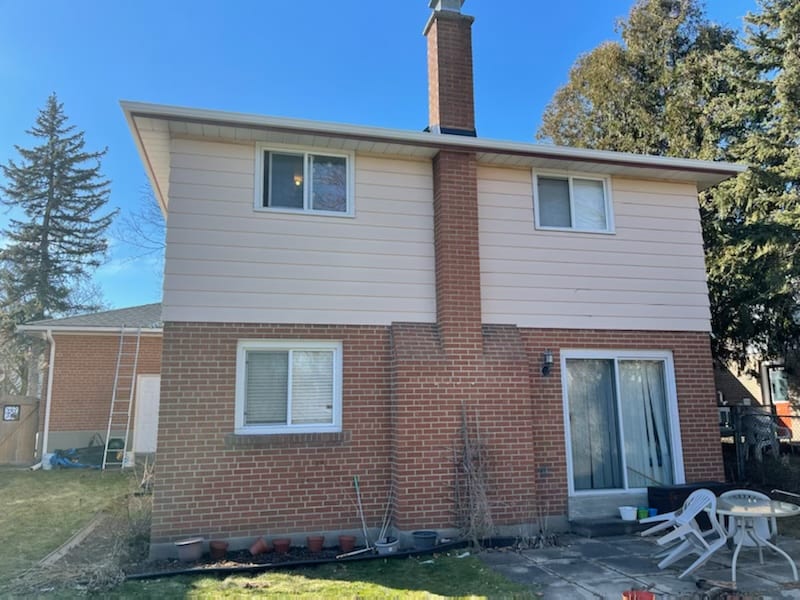 Rear elevation with new white gutters and soffit