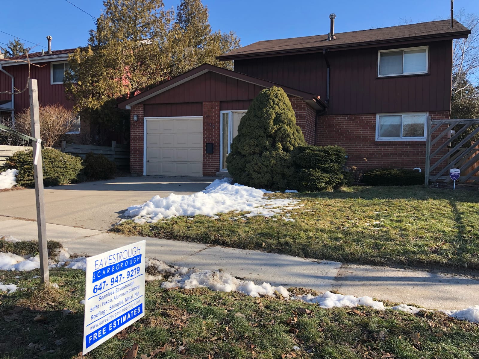 Two-storey home after eavestrough and exterior work